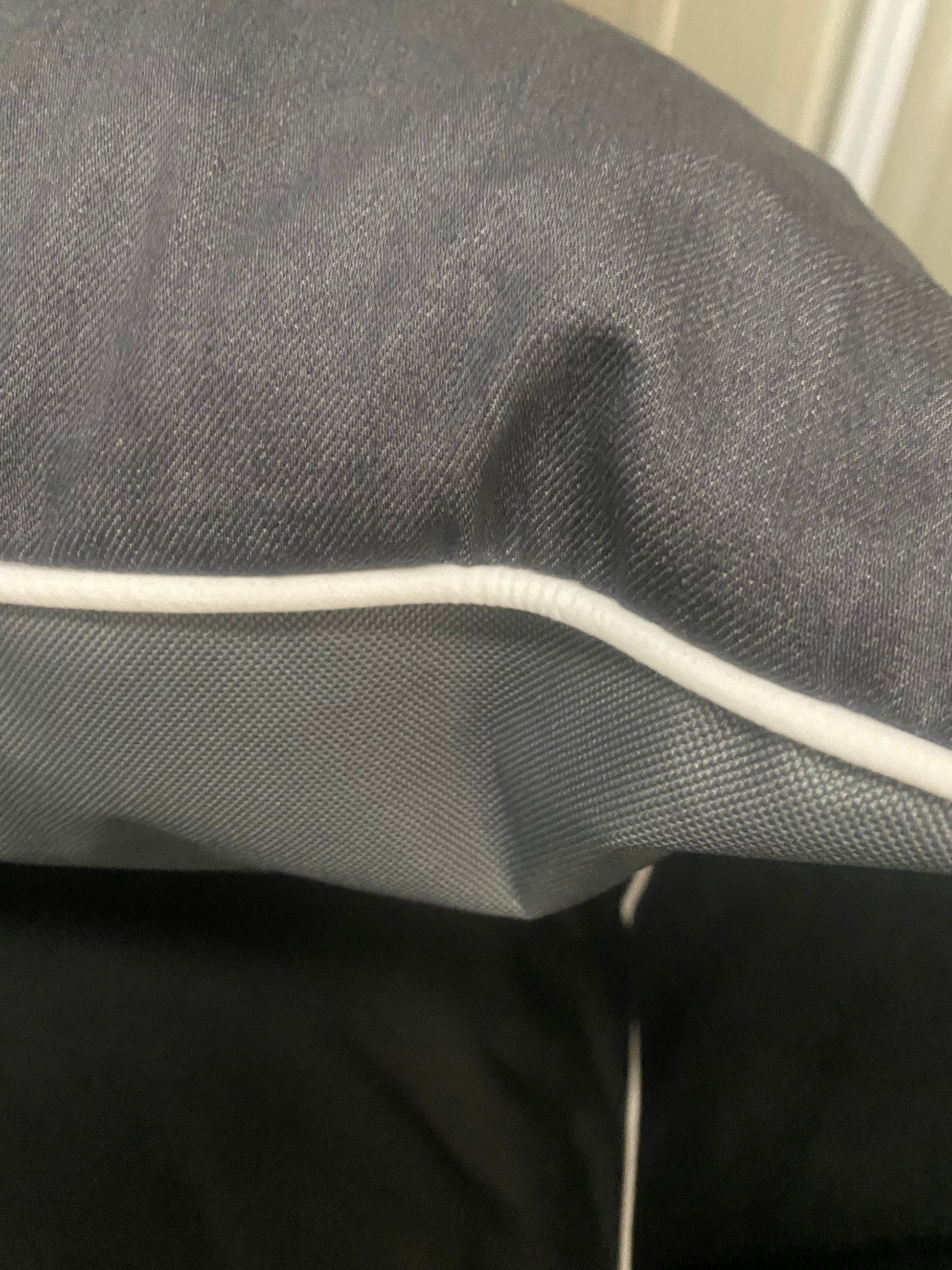 Denim on top - cool white piping and waterproof fabric on the bottom